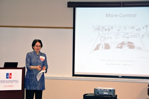 Linguistics professor discusses technology at a faculty down the road alumni event.